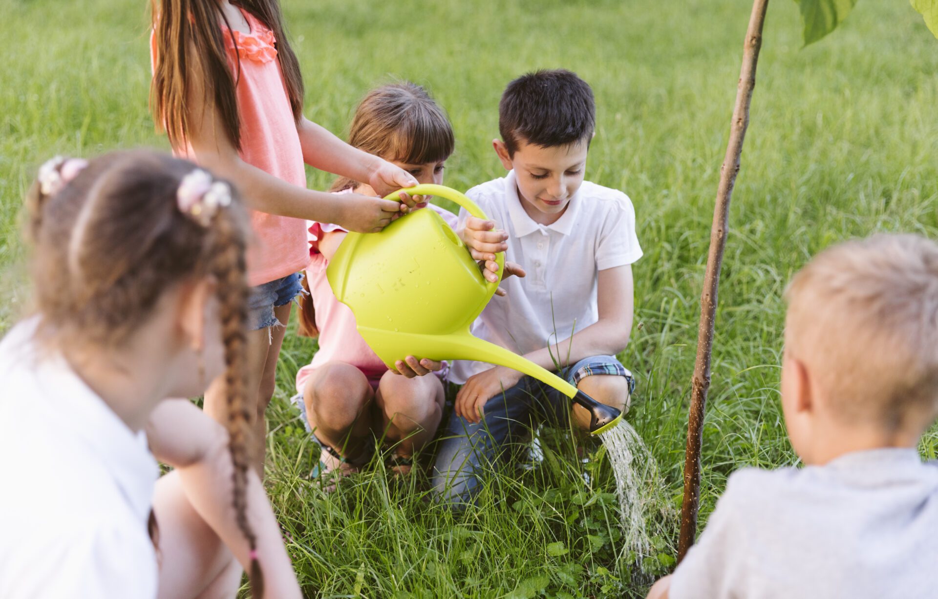 kids-plating-watering-tree